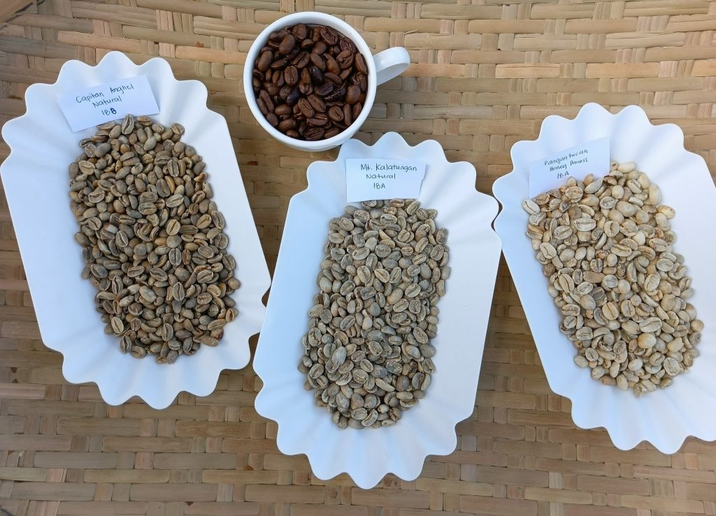 Green and roasted coffee beans sourced from local farmers involved in a coffee project helping abandoned children in the Philippines