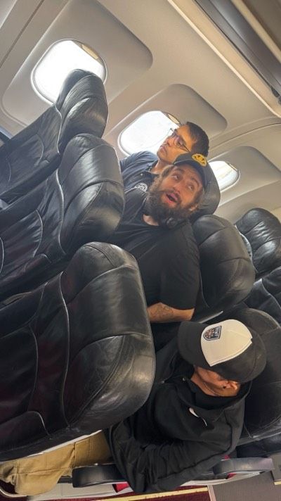 Vitaly Zdorovetskiy seated inside an aircraft as he is deported from the Philippines following harassment complaints