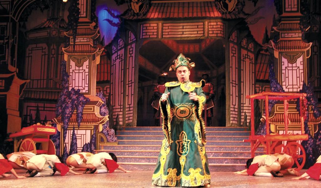 Jojo Dela Cerna performing as the Emperor in the stage musical Aladdin