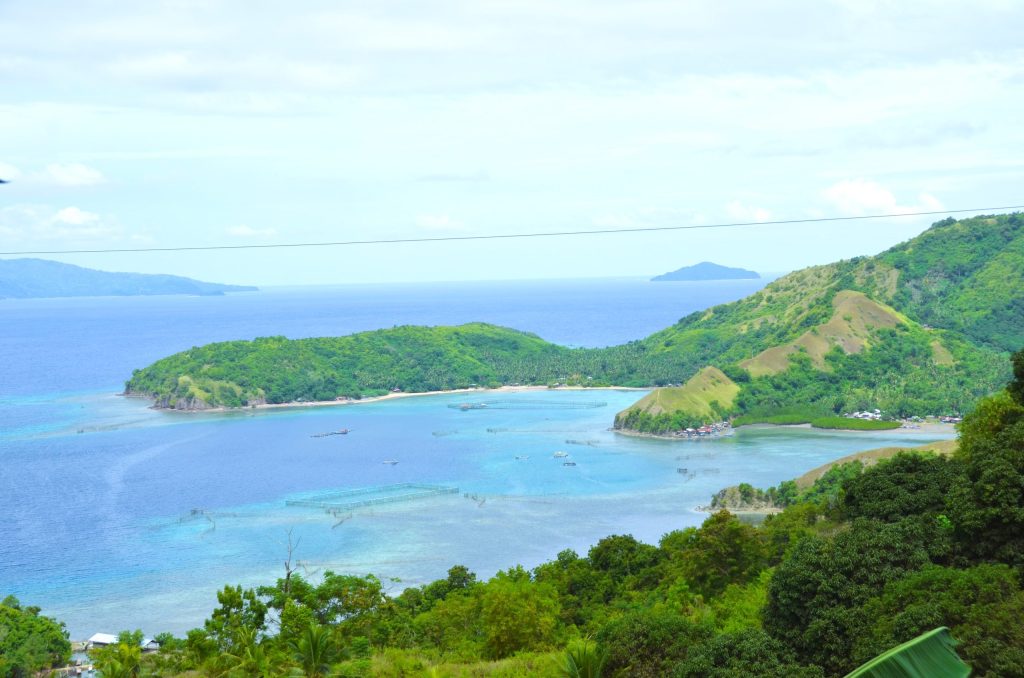 A scenic view of the Sleeping Dinosaur viewpoint overlooking the coastline of Mati City.