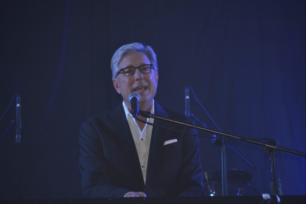 Don Moen music ministry as he plays the piano and leads worship through song