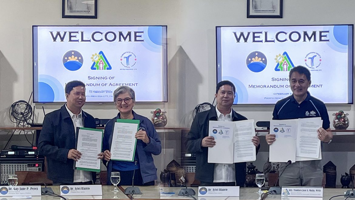 Officials present signed Memoranda of Agreement during the 2026 PINAS Palawan MOU signing supporting environmental protection efforts.
