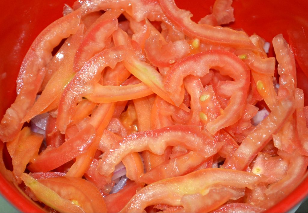Sliced tomato used in research studying the effects of biotech tomato for hypertension.