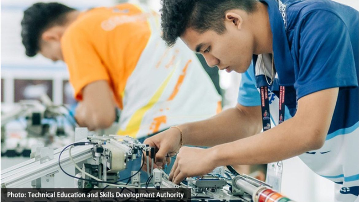 Tech-voc graduates Philippines working on technical training equipment at a vocational education laboratory, highlighting employment outcomes and skills development.
