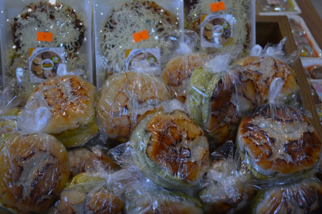 Founders of Axl Dave Bibingka Davao de Oro stand behind the coffee counter inside the store.