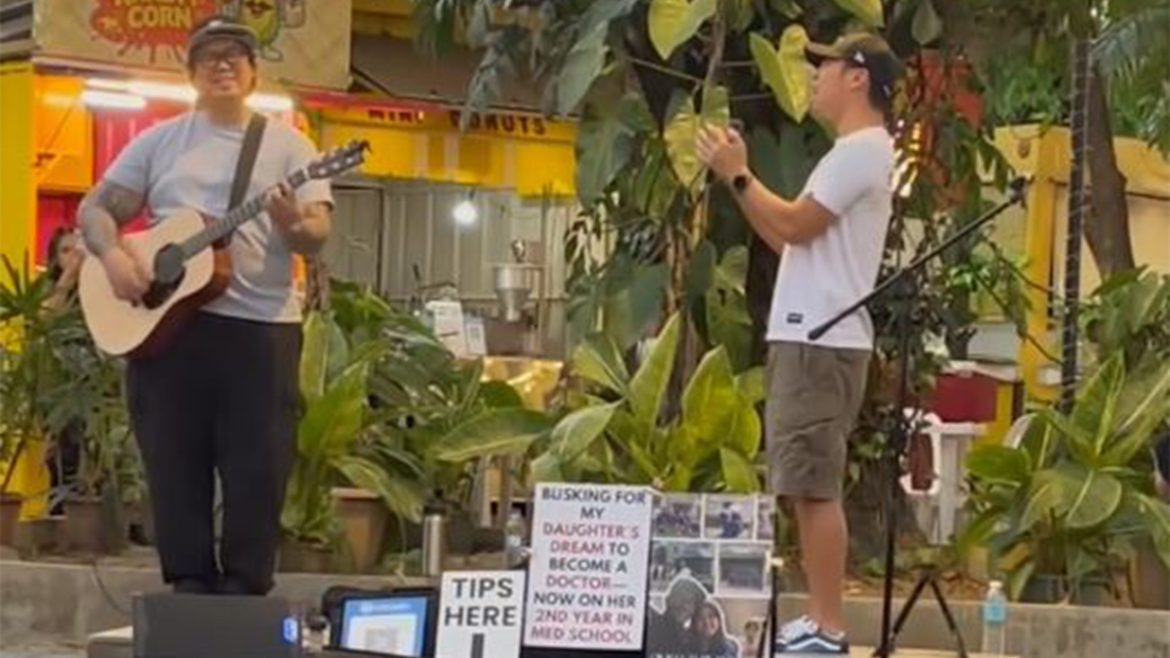 Chito Miranda performing with a busking dad in the Chito Miranda busking dad viral video in the Philippines
