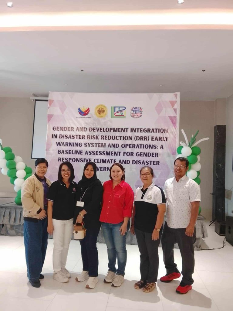 Provincial officials pose during a Gender and Development program activity in Davao de Oro.