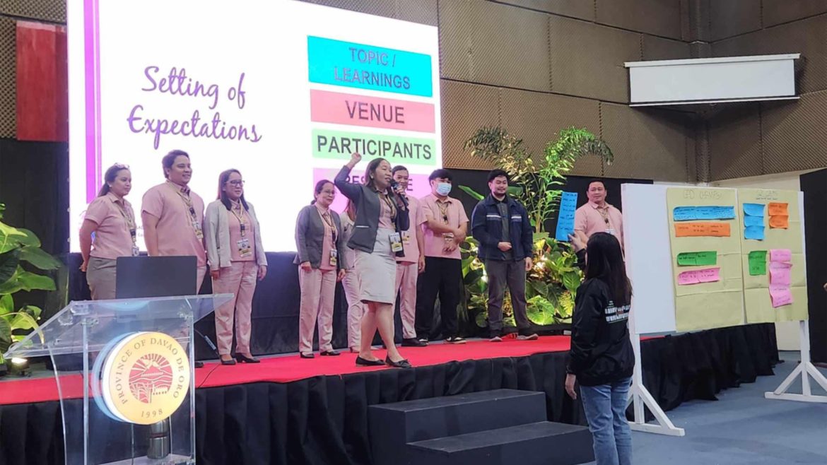 Participants show support for safe spaces and violence against women awareness campaign in Davao de Oro.