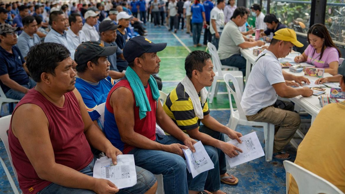 Transport drivers receive financial assistance under fuel subsidy Philippines program during distribution event