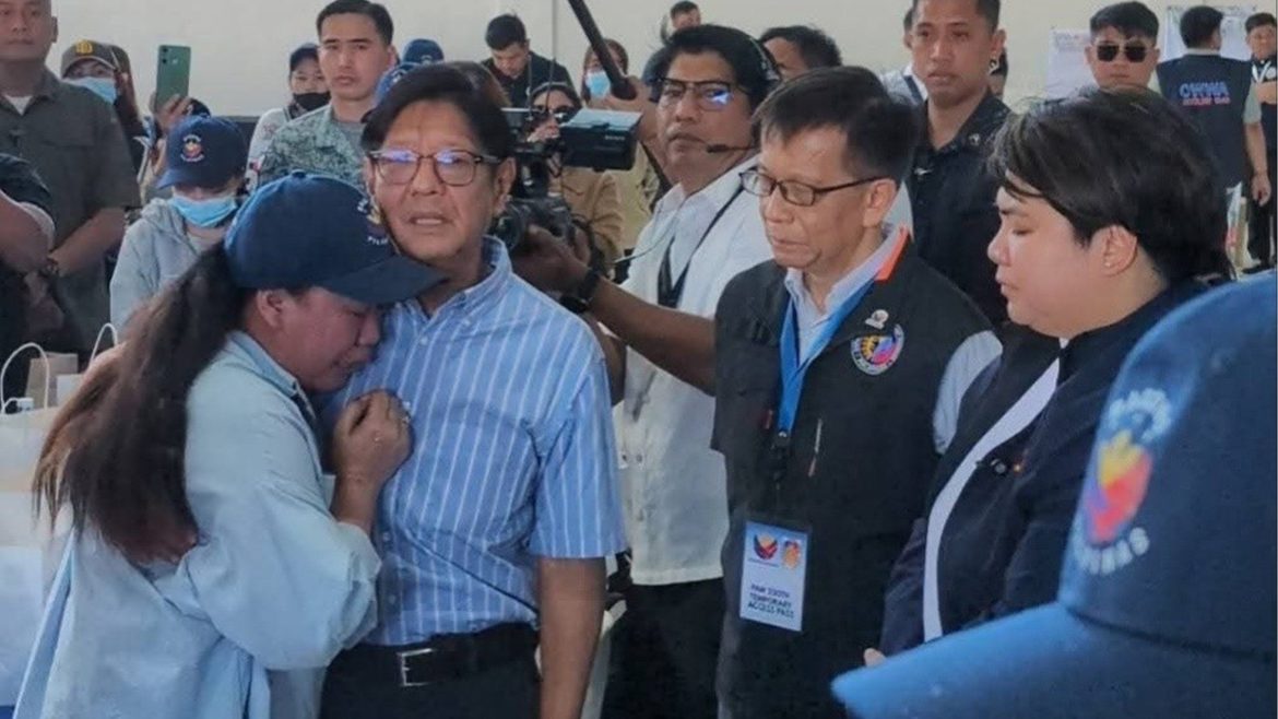 President Ferdinand Marcos Jr. greets returning overseas Filipino workers during OFW repatriation Middle East operations at Villamor Air Base