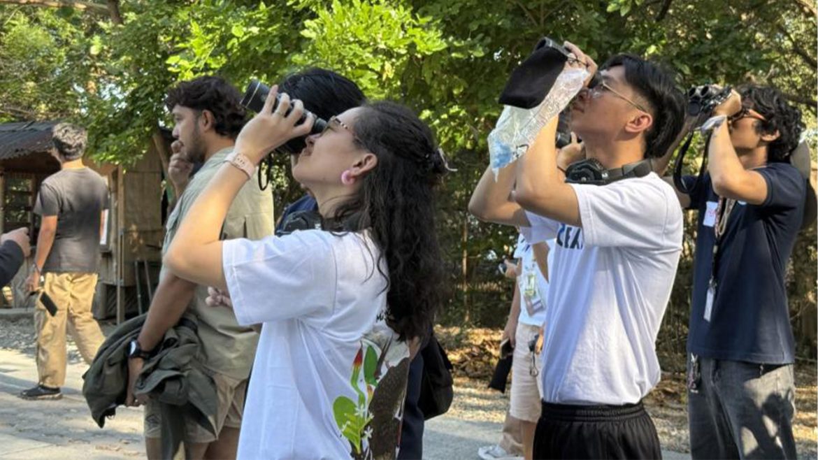 Participants observe coastal environment during mangrove science communicators Philippines field activity