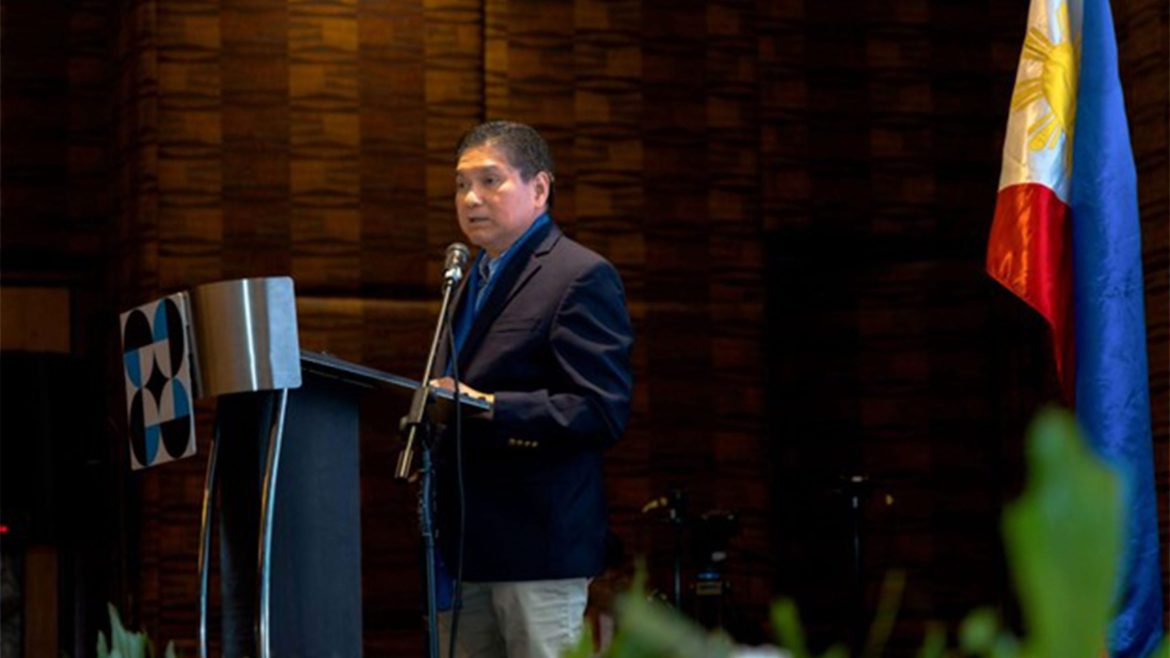 DOST official speaking at event about SDG convergence with HEIs in the Philippines