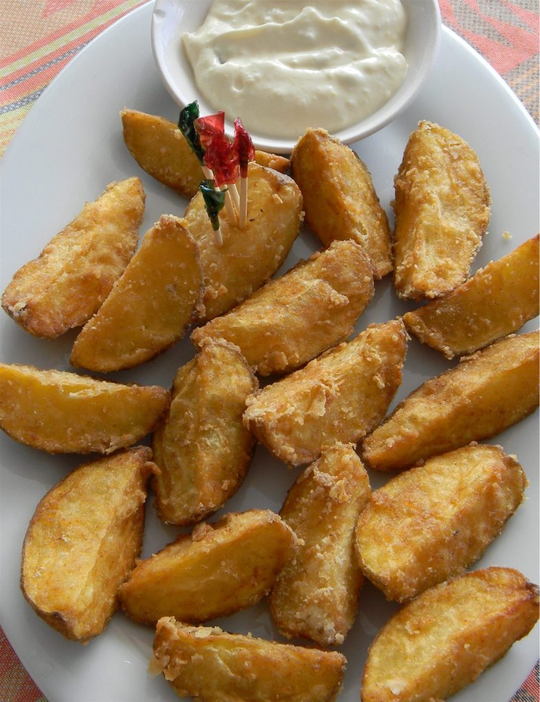 Cooked potato wedges served as part of healing foods and balanced nutrition
