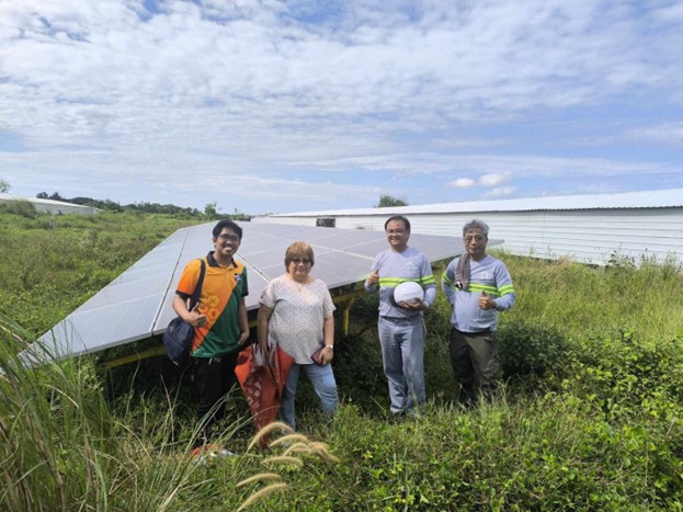 DOST personnel and workers inspecting solar panels in Pangasinan