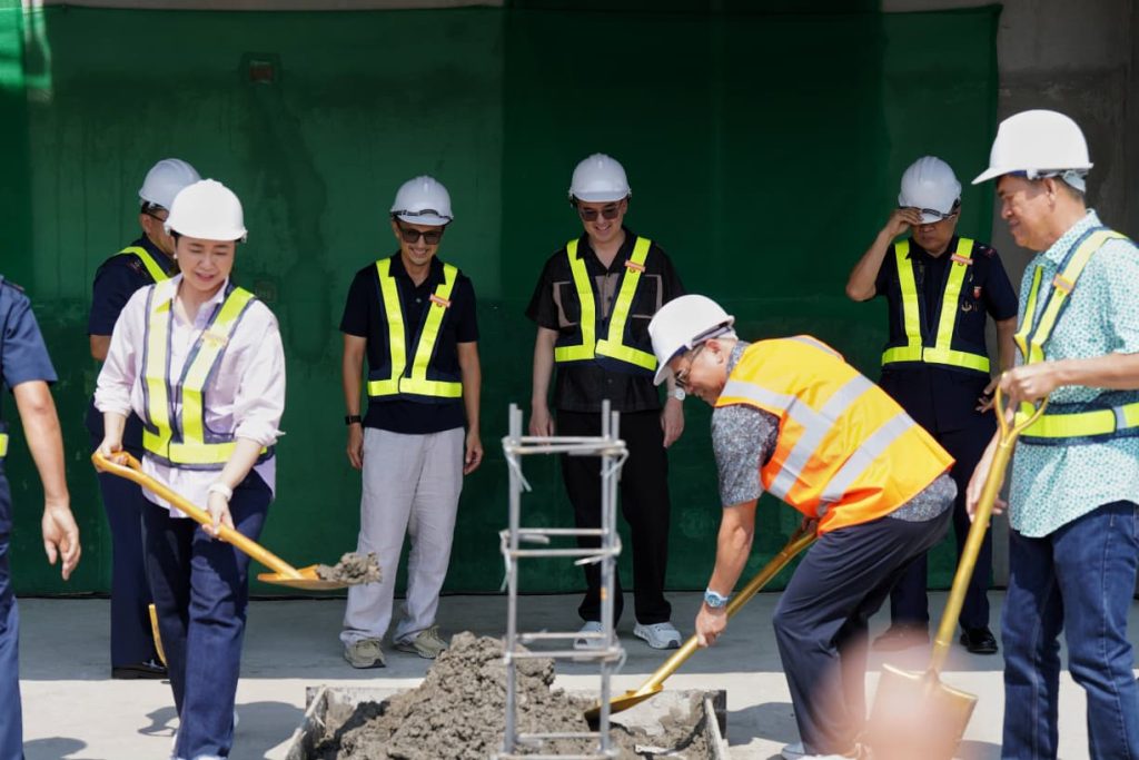 Officials participate in a ceremonial groundbreaking activity for the forensic laboratory project in Taguig City.