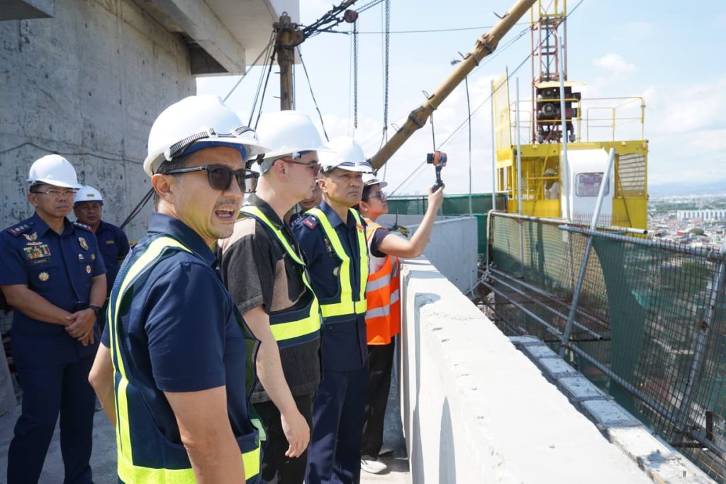 Engineers and government officials inspect the upper floors of the forensic laboratory construction project.